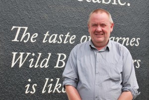 General Manager Graeme Wright in front of the new signage.