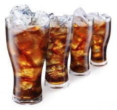 Glasses with cola and ice cubes on a white background