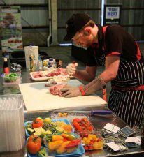 Young butcher Ben Henry in action 